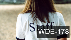 Woman wearing "staff" shirt 